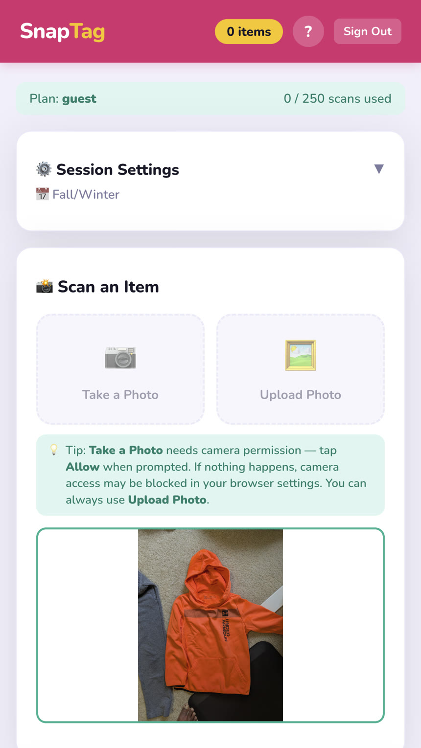 SnapTag scan screen with a photo of an orange hoodie